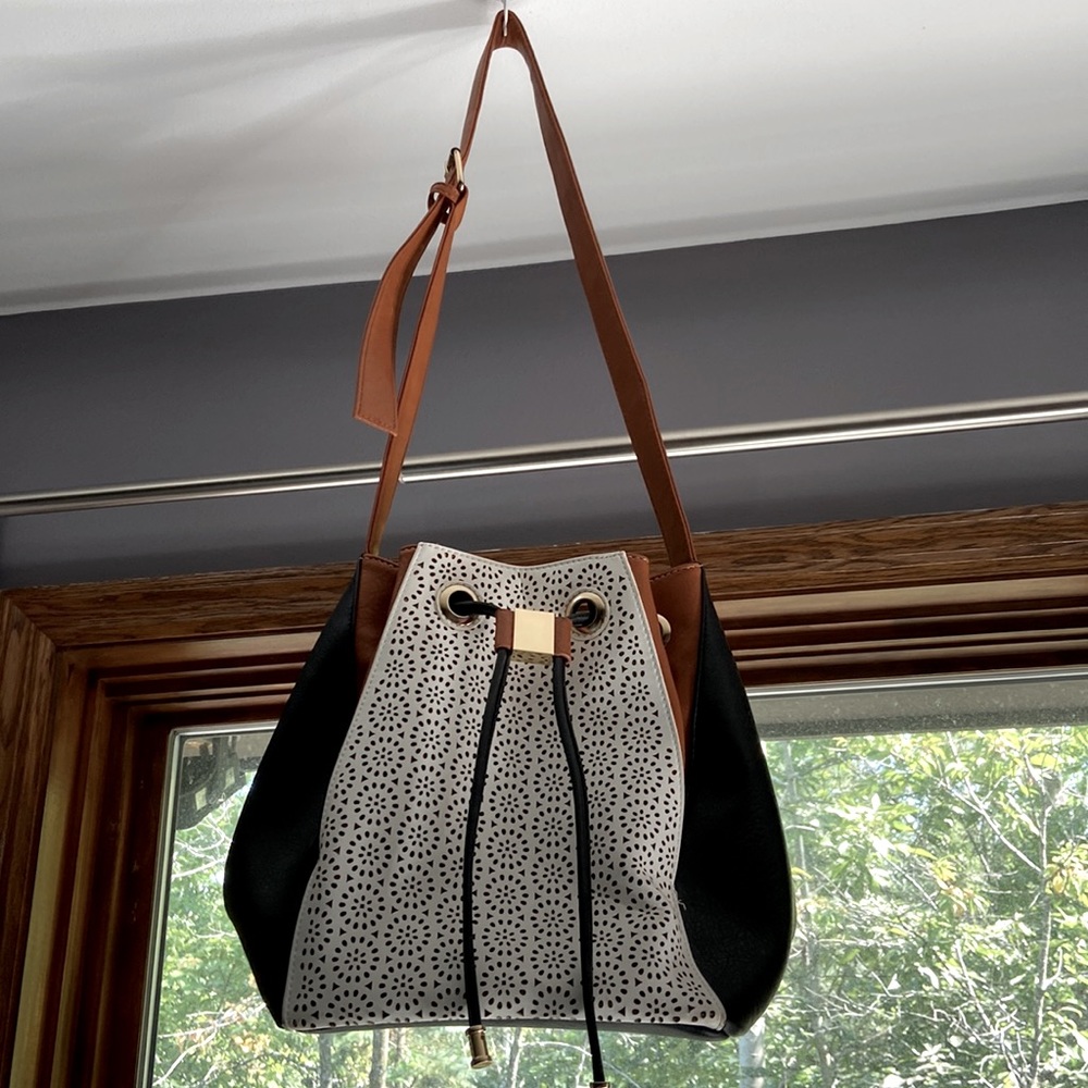 Justfab perforated drawstring bucket handbag